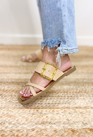 Dakar Sandals in Natural, flat sole raffia strapped sandals with two small straps over the toes and one big strap over the top of the foot with a gold bamboo buckle