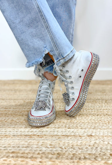 Ash High Top White Sneakers, white high top with red lining, silver stud details on the bottom of the shoe, silver laces, and a rhinestone attachment on the toe