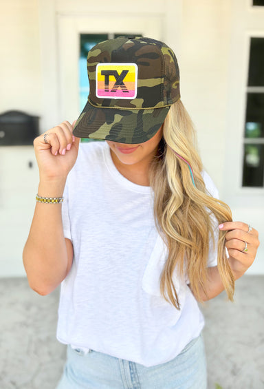 Texas Camo Trucker Hat, camo otto trucker hat with yellow, orange, and pink rectangle patch with white outline and black TX inside 