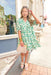 Charleston Stroll Dress, cream, green, light blue, and tan floral and leaf short puff sleeve dress with quarter button down detail and tiering 