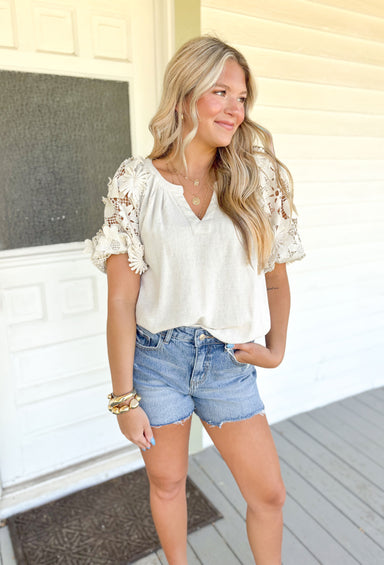 Chasing Love Top in Oatmeal, washed oatmeal colored top with rounded v-neck and floral lace sleeves