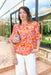 Let's Start Fresh Blouse, hot pink, orange, sunset yellow, and white floral printed quarter sleeve v-neck blouse with white lace detailing across the chest