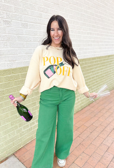 Friday + Saturday: Pop Off Corded Pullover, tan corded crew with graphic on the front "pop off" in yellow and a champagne bottle in pink and green
