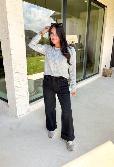 Relaxed and effortlessly cool, these black baggy wide leg jeans are the denim upgrade your fall closet needs. Designed with a flattering high waist and a trendy cuffed hem, they strike the perfect balance of casual and polished. These are great for showing off ankle boots or sneakers, while the soft, modal-blend denim keeps them comfortable with just the right amount of stretch. Whether styled with a cozy sweater or a sleek blouse, these jeans are versatile enough to take you anywhere this season.