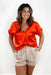 Alexandra Blouse in Tomato Orange, orange short sleeve blouse, cuffed sleeve, v-neck