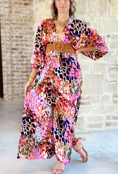 Bold Beauty Maxi Dress, Abstract leopard maxi dress with deep v- neck line and flowy quarter length sleeves. Colors are black, light blue, army green, light magenta, coral, brown and cream 