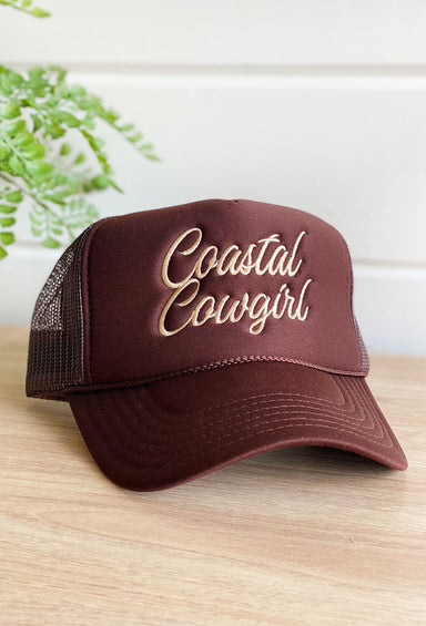 Charlie Southern: Coastal Cowgirl Trucker Hat, brown trucker hat with tan embroidered that says "coastal cowgirl"