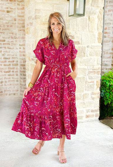 Catching Feelings Midi Dress, abstract lines midi  short sleeve dress with a cinched waist line and cuffed sleeves. Colors are magenta, fuchsia, cranberry, yellow, and cream 