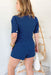 City Chic Denim Romper in Navy, Collared romper, puff sleeve with button detailing. Crossed over chest with snap button