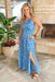 Coastal Charm Maxi Dress, Blue and white maxi dress with a unique print, featuring a single shoulder, leg slit, and smocked backing