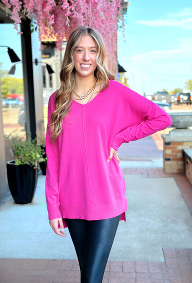 Dreamers Must Have Sweater in Electric Pink, long thin sweater with seam down the center and ribbing on the hem and wrists