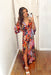 Bold Beauty Maxi Dress, Abstract leopard maxi dress with deep v- neck line and flowy quarter length sleeves. Colors are black, light blue, army green, light magenta, coral, brown and cream