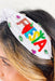 Fiesta Beaded Headband, white headband with "fiesta" beaded on each sideband colorful gemstones scattered on headband