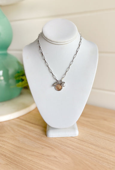 First Glances Necklace in Silver, Silver paper clip chain necklace with rhinestone, coin, and pearl charm in the center