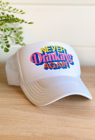 Friday + Saturday: Never Drinking Again Trucker Hat, white hat with "never drinking again" in different colors on front