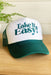 Friday + Saturday: Take It Easy Trucker, green trucker hat with white front and "take it easy" vinyl on front