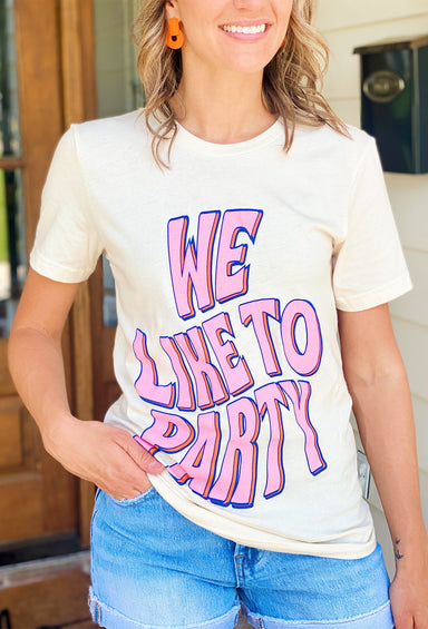 Friday + Saturday: We Like To Party T-Shirt, cream tee with "we like to party" printed on the front of the shirt