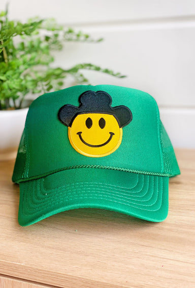 Happy Cowboy Trucker Hat in Green, green trucker ht with smiley face wearing a cowboy hat