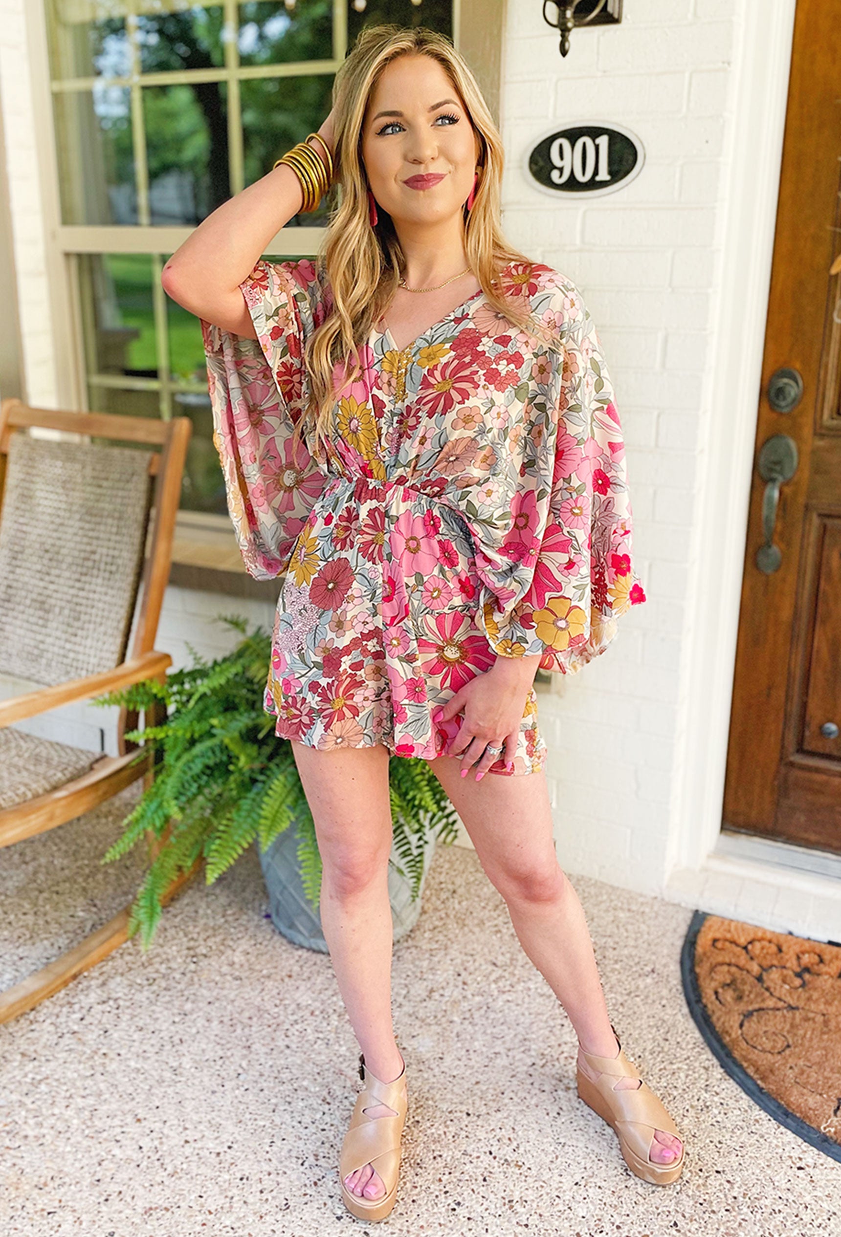 Hidden Paradise Floral Romper, Romper featuring vibrant colors and oversized billowy sleeves and a V neckline