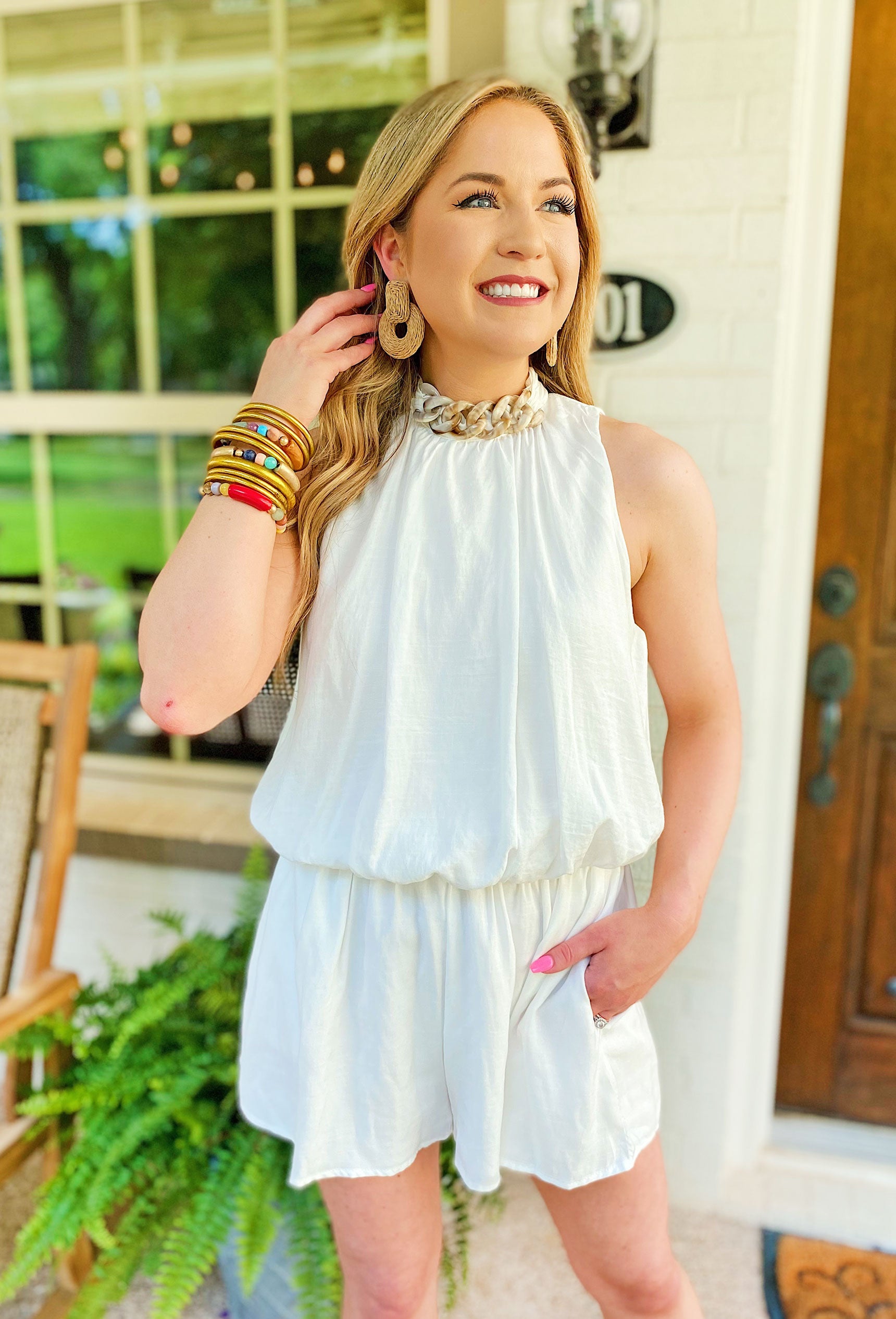 In Your Dreams Romper, white halter top and an alluring open back, White romper with a neutral acrylic chain detail across the front and an open back