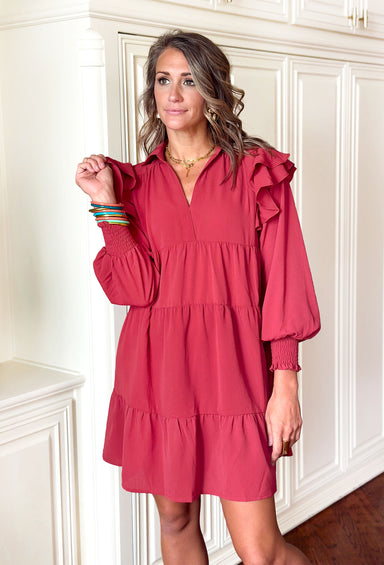 Join The Party Dress, rosie long sleeve dress with ruffles on the shoulders, collar, v-neck, tiering, and cinching on the wrists