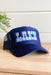 Charlie Southern: Lake Trucker Hat, blue trucker hat with embroidered "lake" on the front