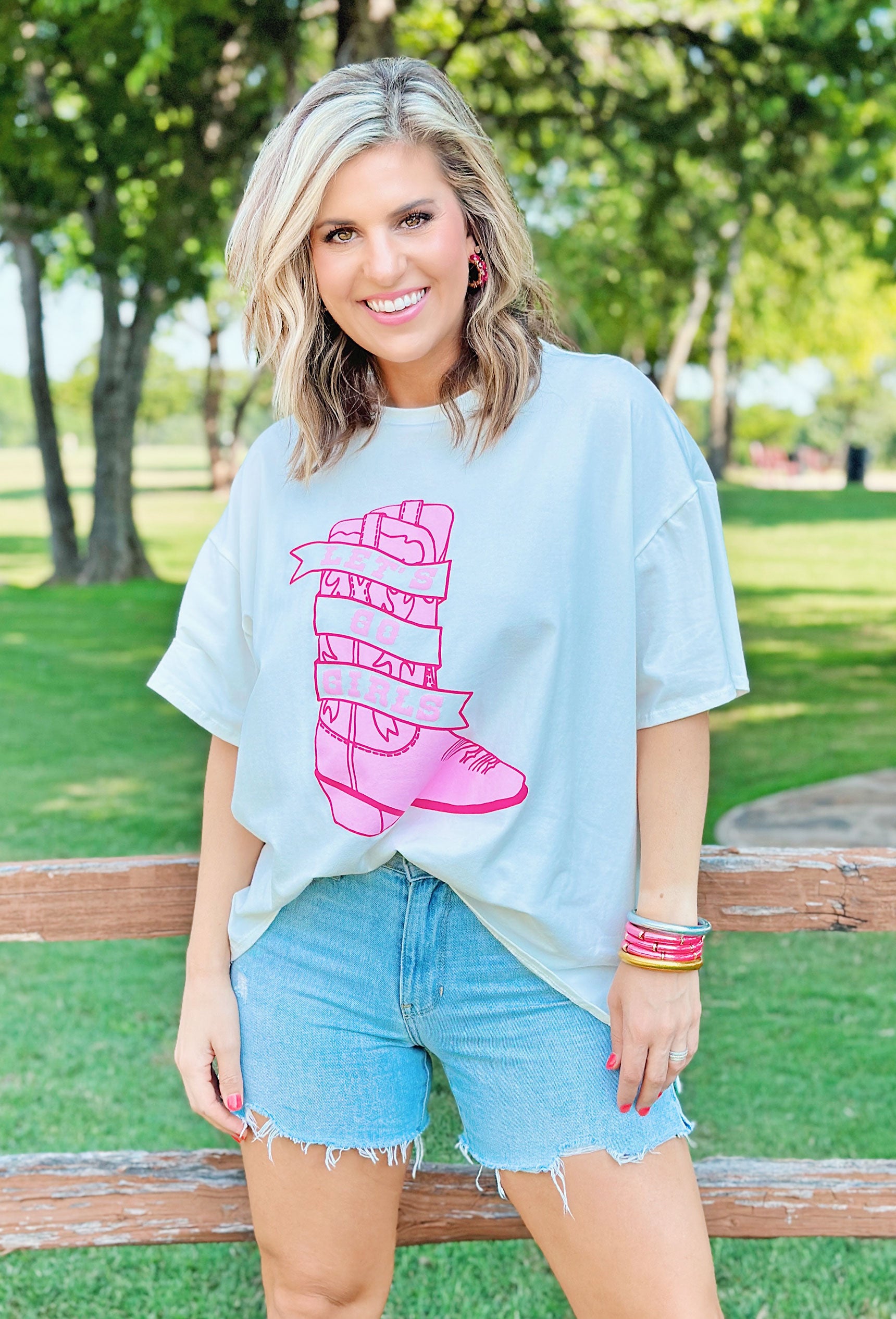 Let's Go Girls Graphic Tee, White graphic tee with a pick boot with the words "lets go girls" across it