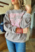 Nashville Tennessee Graphic Pullover, grey crewneck with pink graphic on the front saying "Nashville music city (two guitars with wings) Tennessee"