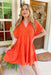 Nikoleta Linen Shirtdress in Tomato Red, Orange dress with a babydoll inspired fit and tiers, cuff sleeves and a frayed hem