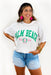 Palm Beach Graphic Tee, white oversized tee with "palm beach" in green 