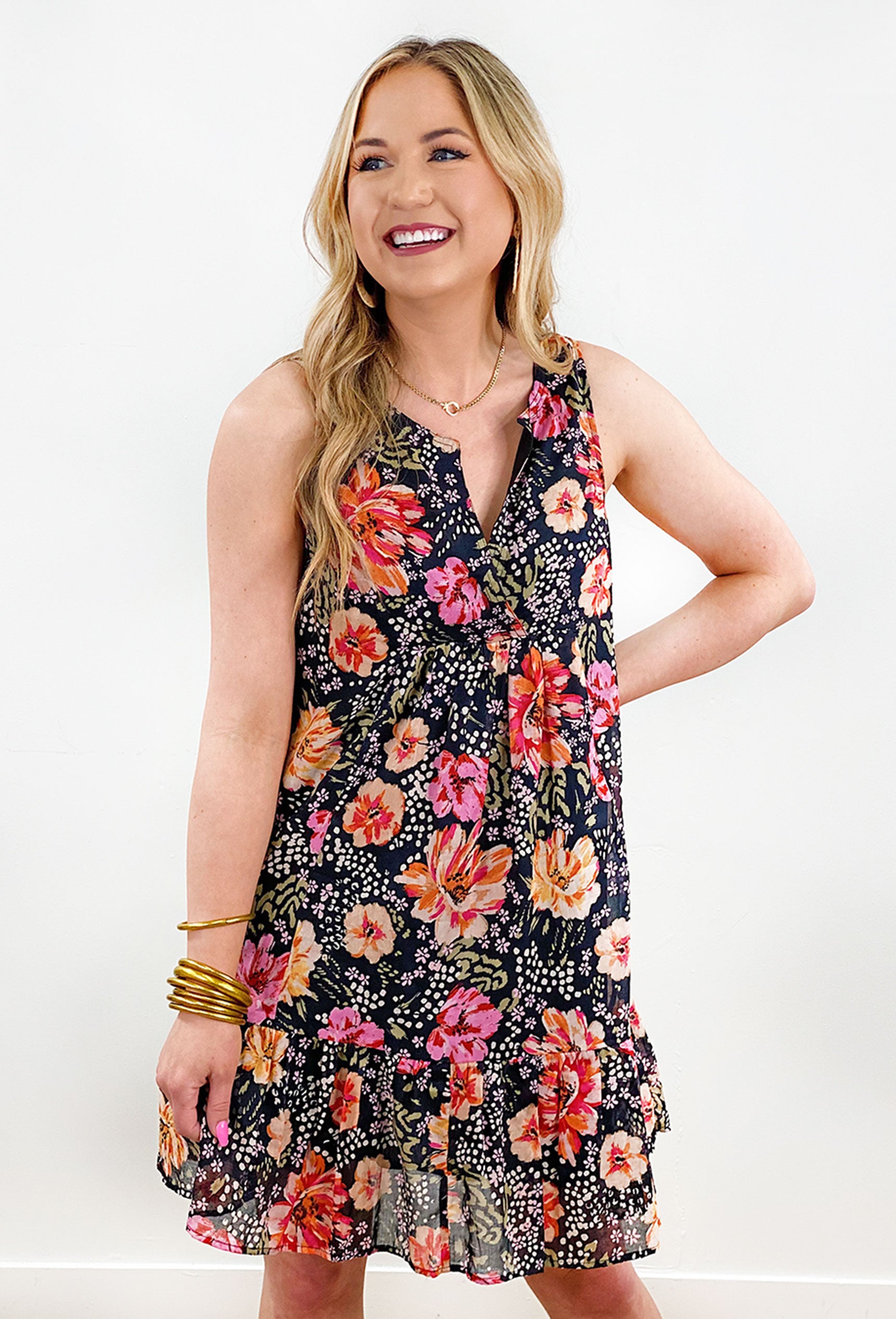 Plaza Brunch Floral Dress, Black mini dress enhanced by a vibrant floral print, delicately accented with subtle animal spots and a flattering v-neckline and breathable sleeveless cut