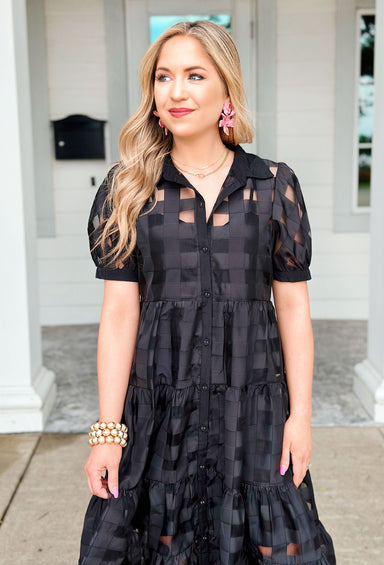 Step Into Style Midi dress, black short-sleeved button-down midi dress, it features a sheer black gingham overlay