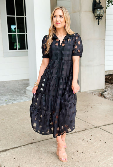 Step Into Style Midi dress, black short-sleeved button-down midi dress, it features a sheer black gingham overlay