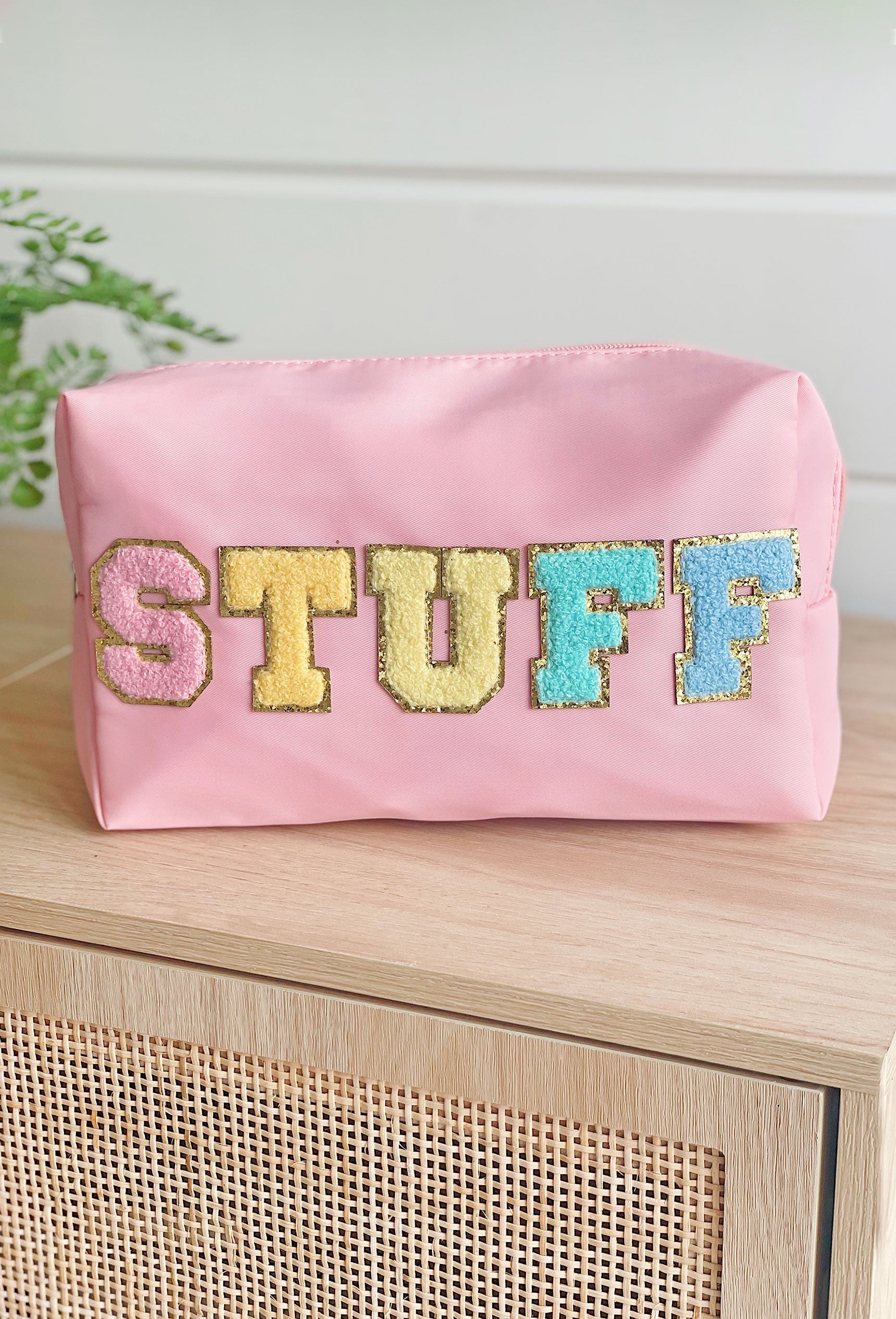 Stuff Cosmetic Bag in Pink, Pink nylon cosmetic bag with "stuff" printed in a colorful textured font