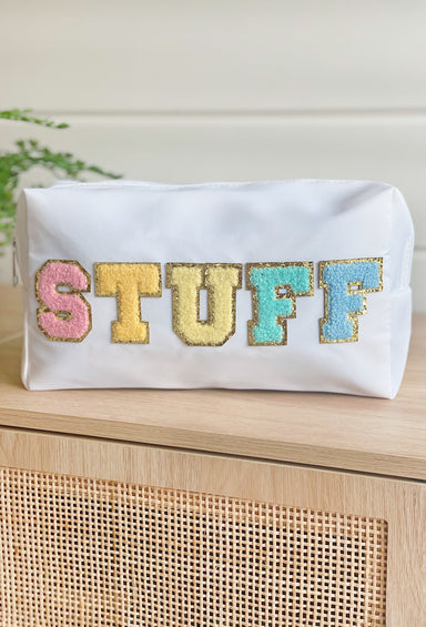 Stuff Cosmetic Bag in White, White nylon cosmetic bag with "stuff" printed in a colorful textured font