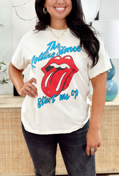 The Rolling Stones Graphic Tee, bone colored t-shirt with "the rolling tones start me up" in blue outlined in black and their logo in red outlined in black