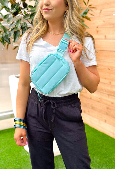 Tori Quilted Belt Bag in Light Blue, light blue belt bag with an adjustable strap and monochromatic zippers.