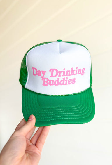 Day Drinking Buddies Trucker Hat, green and white trucker hat with pink font "day drinking buddies" on the front 