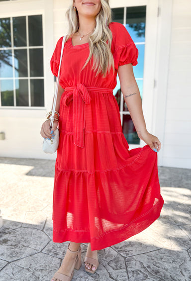 Summer Soiree Midi Dress. Red midi dress with tie around the waist. Puff sleeves and tiered detailing.