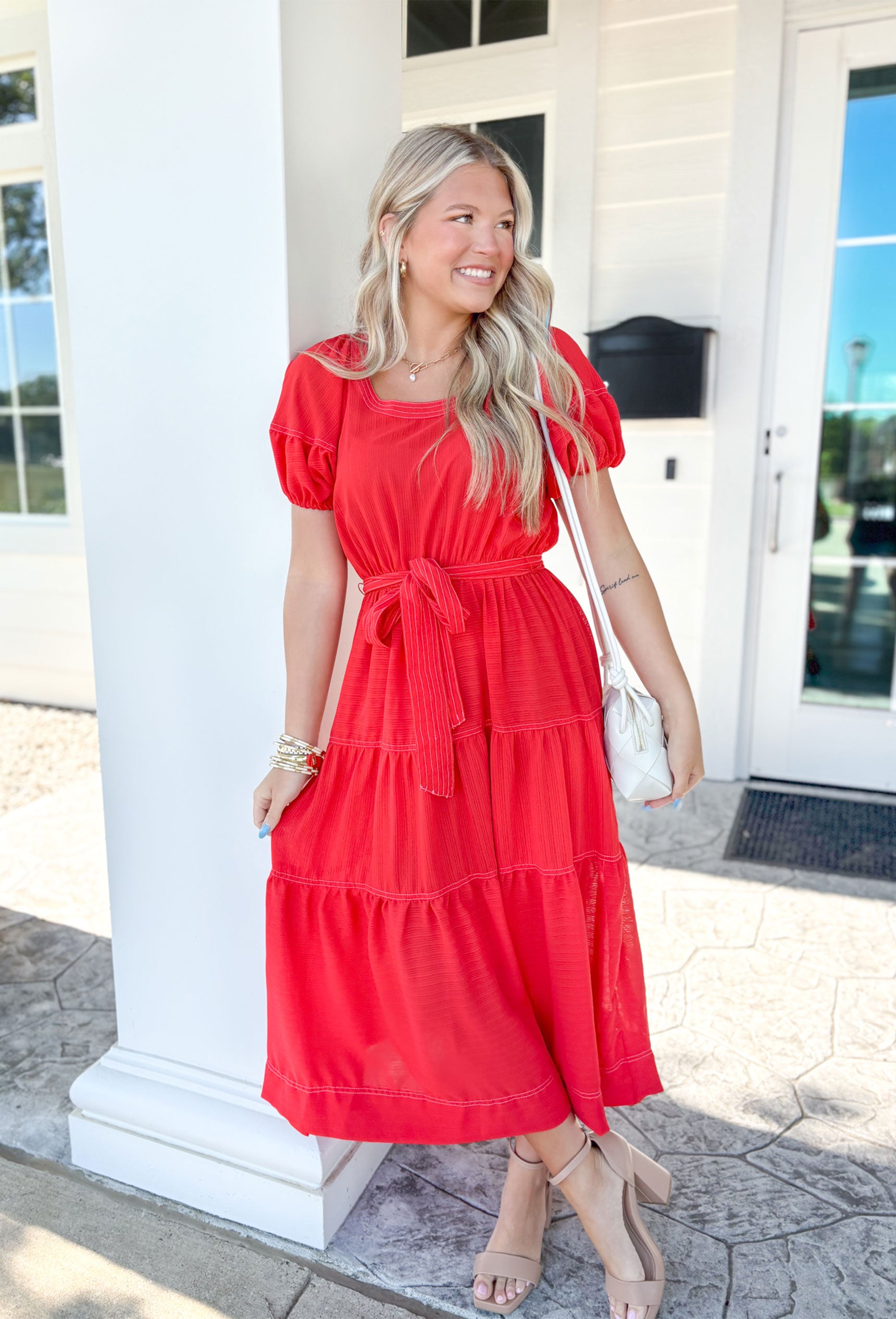Summer Soiree Midi Dress. Red midi dress with tie around the waist. Puff sleeves and tiered detailing.