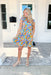 Sunny Forecast Dress, short ruffle sleeve dress with v-neck and tiering in a flower pattern in the colors cobalt, azure, royal blue, yellow, seafoam, orange, pink, and hot pink