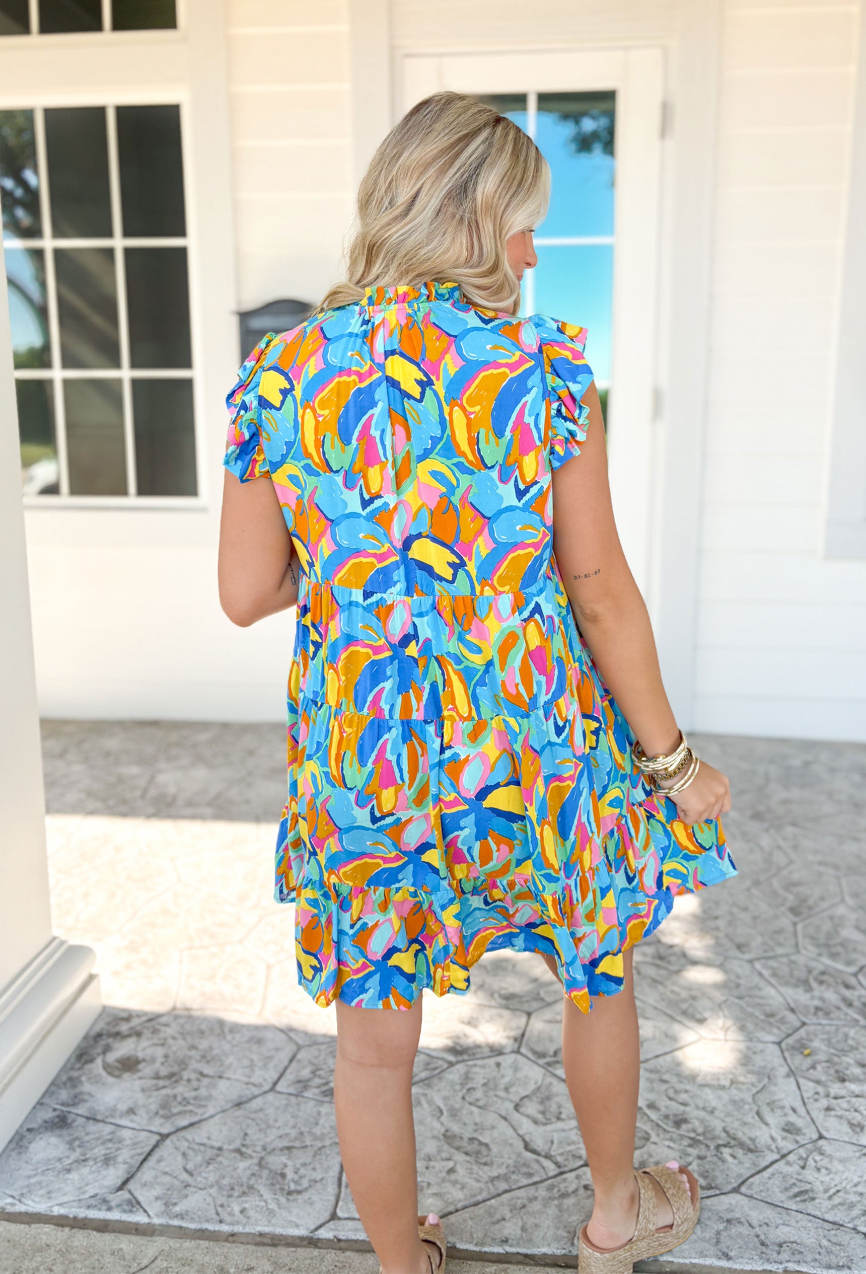 Sunny Forecast Dress, short ruffle sleeve dress with v-neck and tiering in a flower pattern in the colors cobalt, azure, royal blue, yellow, seafoam, orange, pink, and hot pink