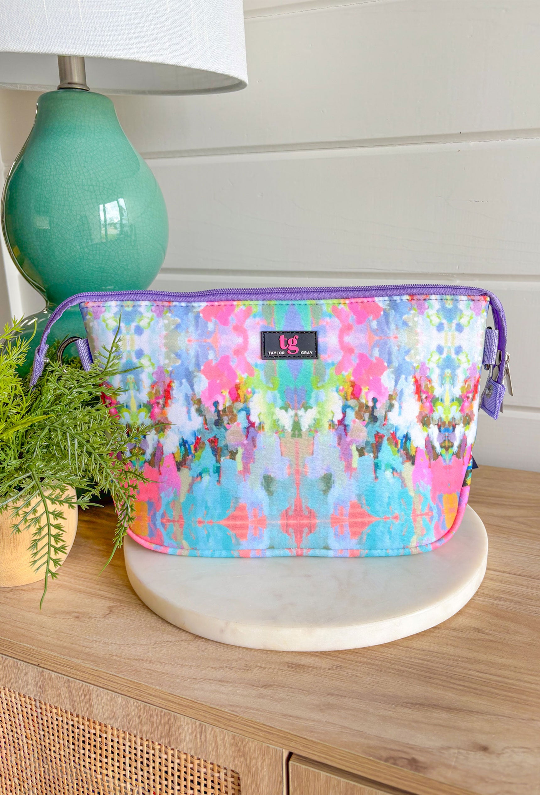 The Brooks Avenue Laura Park Neoprene Large Cosmetic, large cosmetic pouch with double zipper in the "The Brooks Avenue" Patter in the colors lilac, bubblegum pink, lime green, turquoise, blue, orange, sage and off white