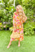 Always Yours Floral Midi Dress, mustard yellow long sleeve wrap dress with light pink, mauve, orange, kelly green, and cranberry floral print