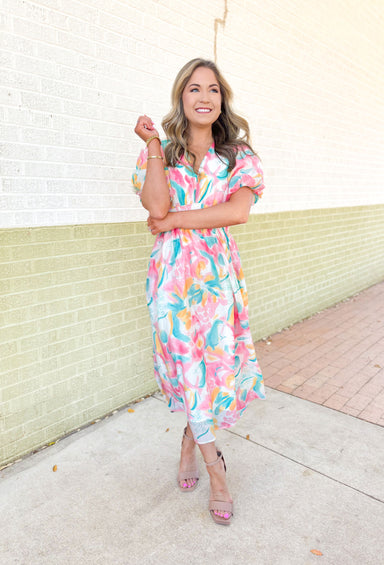 Anything For You Maxi Dress, short puff sleeve maxi dress with abstract floral print on it in the colors teal, yellow, pink and white.V-neck and cinching on the waist