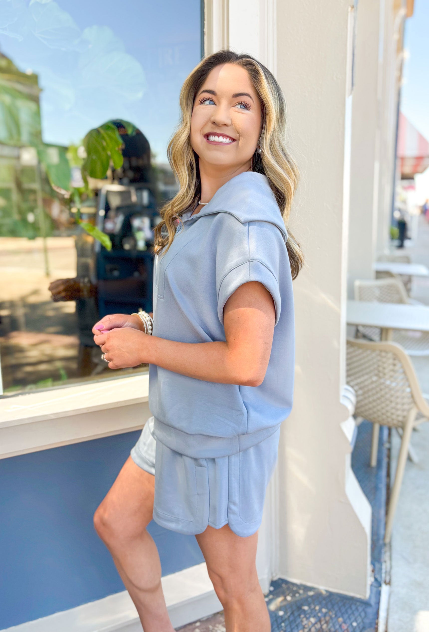 Back On Track Set, light blue grey scuba material short sleeve top and shorts set. Quarter zip down, elastic waist with drawstring and pocket