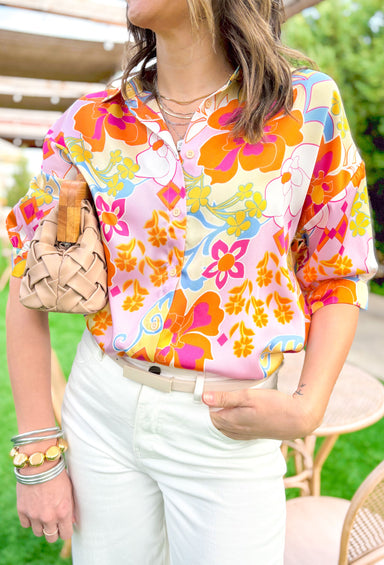 Becca Floral Button Up Top, short sleeve button down blouse with 70's flowers in the colors orange, light pink, hot pink, light blue, yellow, pale yellow, and off white 