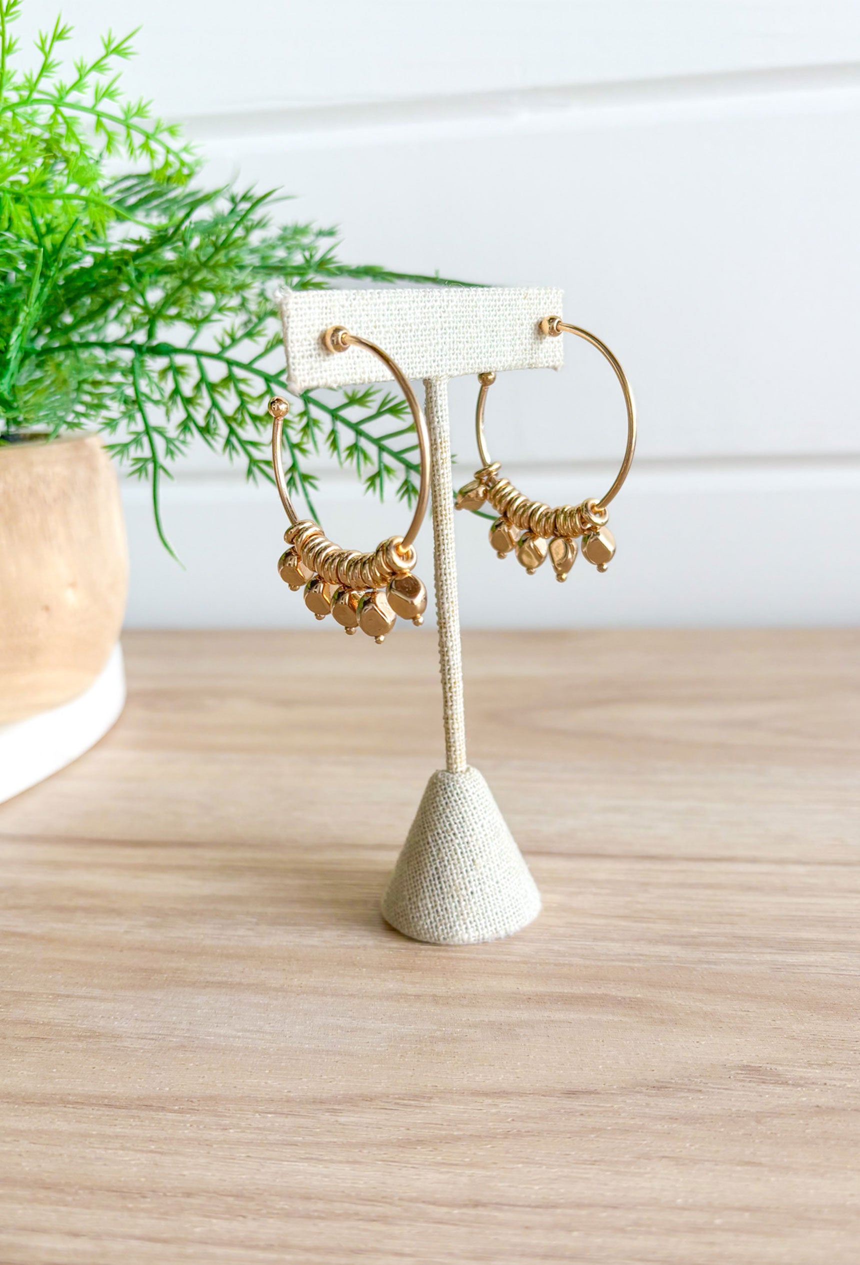 City Escape Earrings in Gold, gold hoop with ring and bead detailing that move around the hoop