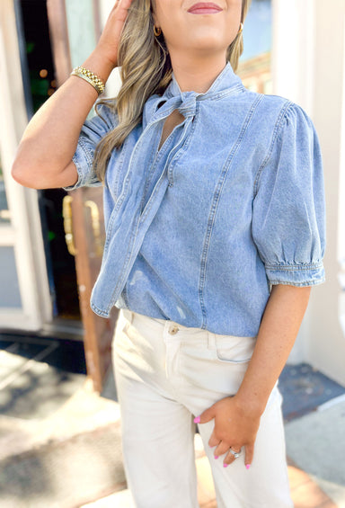 Closer To You Denim Top, short sleeve denim top with tie detail on the front of the neck, sleeves are slightly puffed 