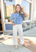 Closer To You Denim Top, short sleeve denim top with tie detail on the front of the neck, sleeves are slightly puffed 